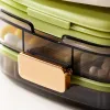 Transparent compartments medicine box with green base, white lid, storage box, cotton swabs, band-aids and pink tablets Application Scenario